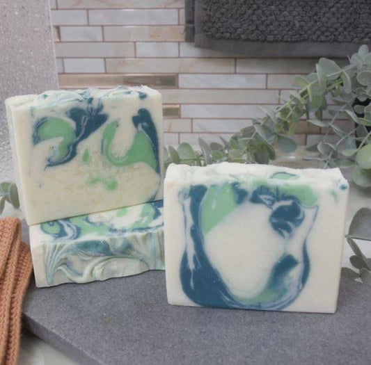 Aloe Vera Cucumber Soap Bar with green and blue swirls, handmade for cooling and hydrating skin care in bath and body routines.