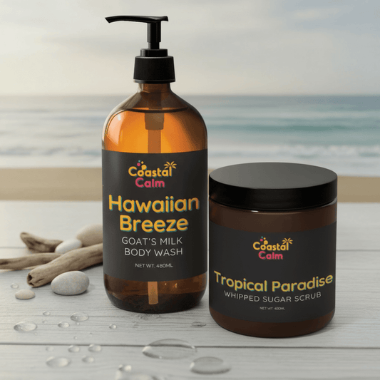 Coastal Calm Hawaiian Breeze body wash and Tropical Paradise whipped sugar scrub on a beach-themed background