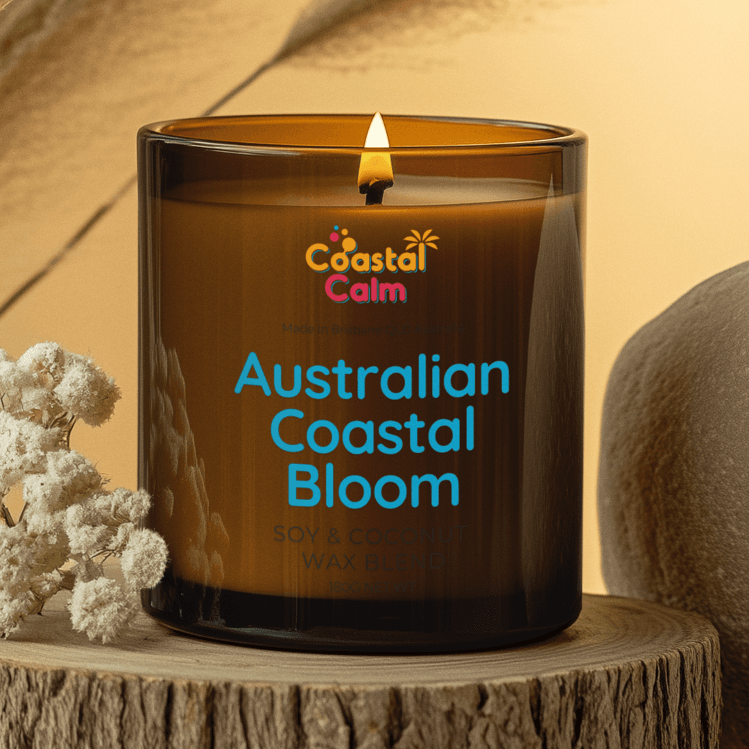 Australian Coastal Bloom Candle in amber glass jar with soy & coconut wax blend, evoking floral coastal scent. Ideal for eco-friendly home decor.