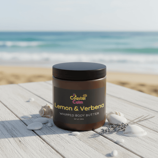 Jar of Coastal Calm Lemon & Verbena Whipped Body Butter on a beach setting